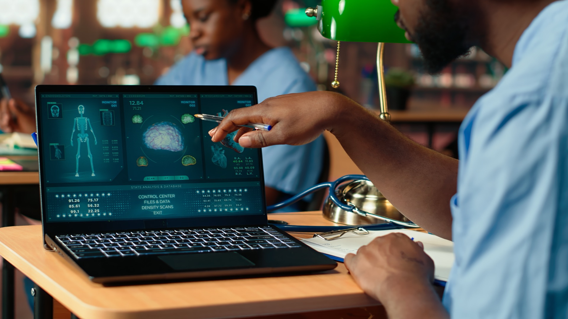 Medical student studying healthcare data on a laptop